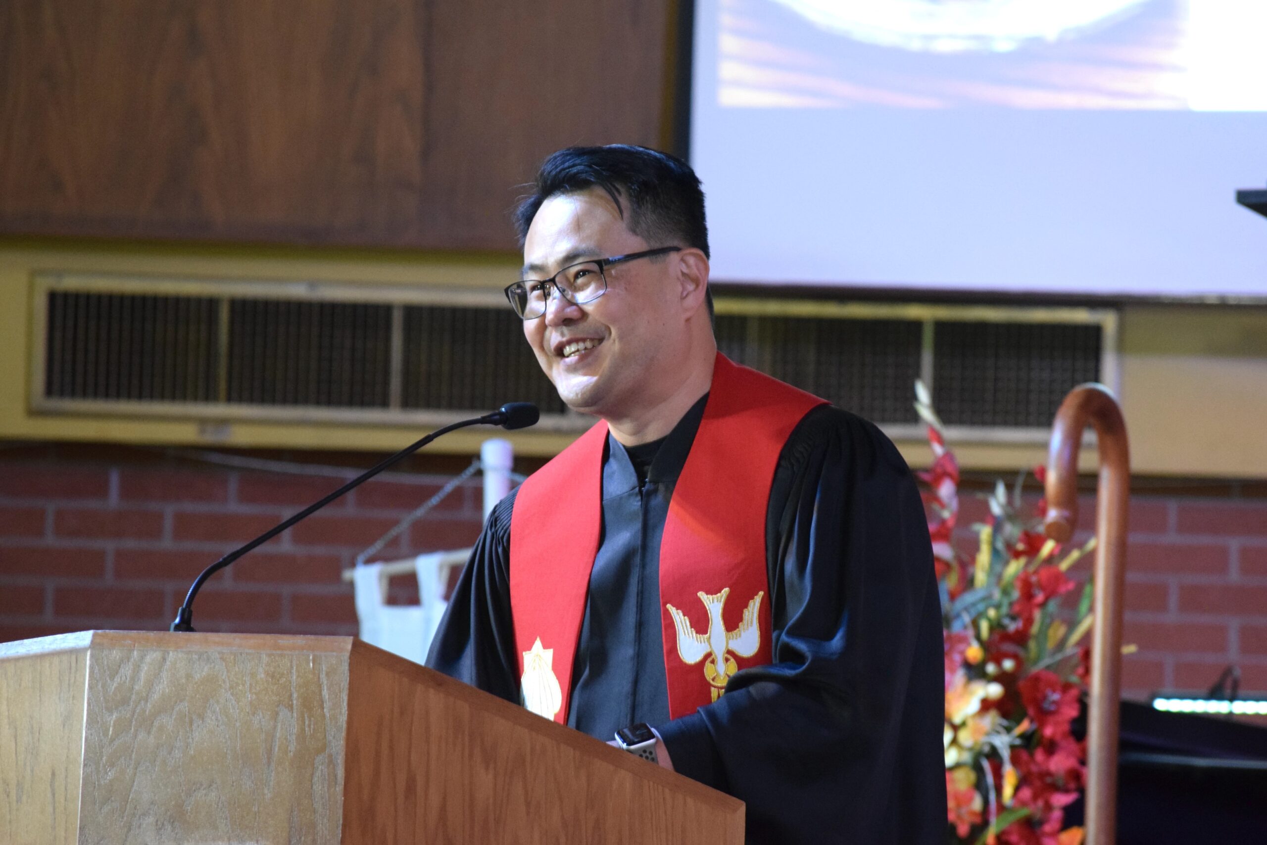 Rev. Young Kang preaching at the pulpit
